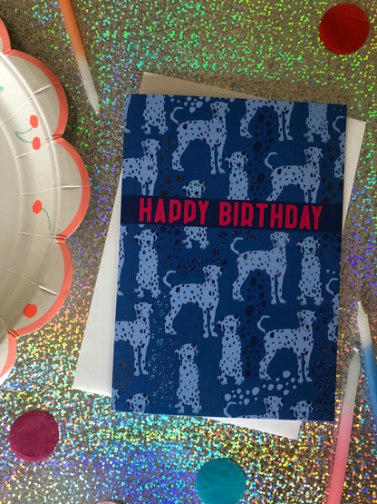 Blue Dalmatian print birthday card featuring a cute dog design on a holographic background.