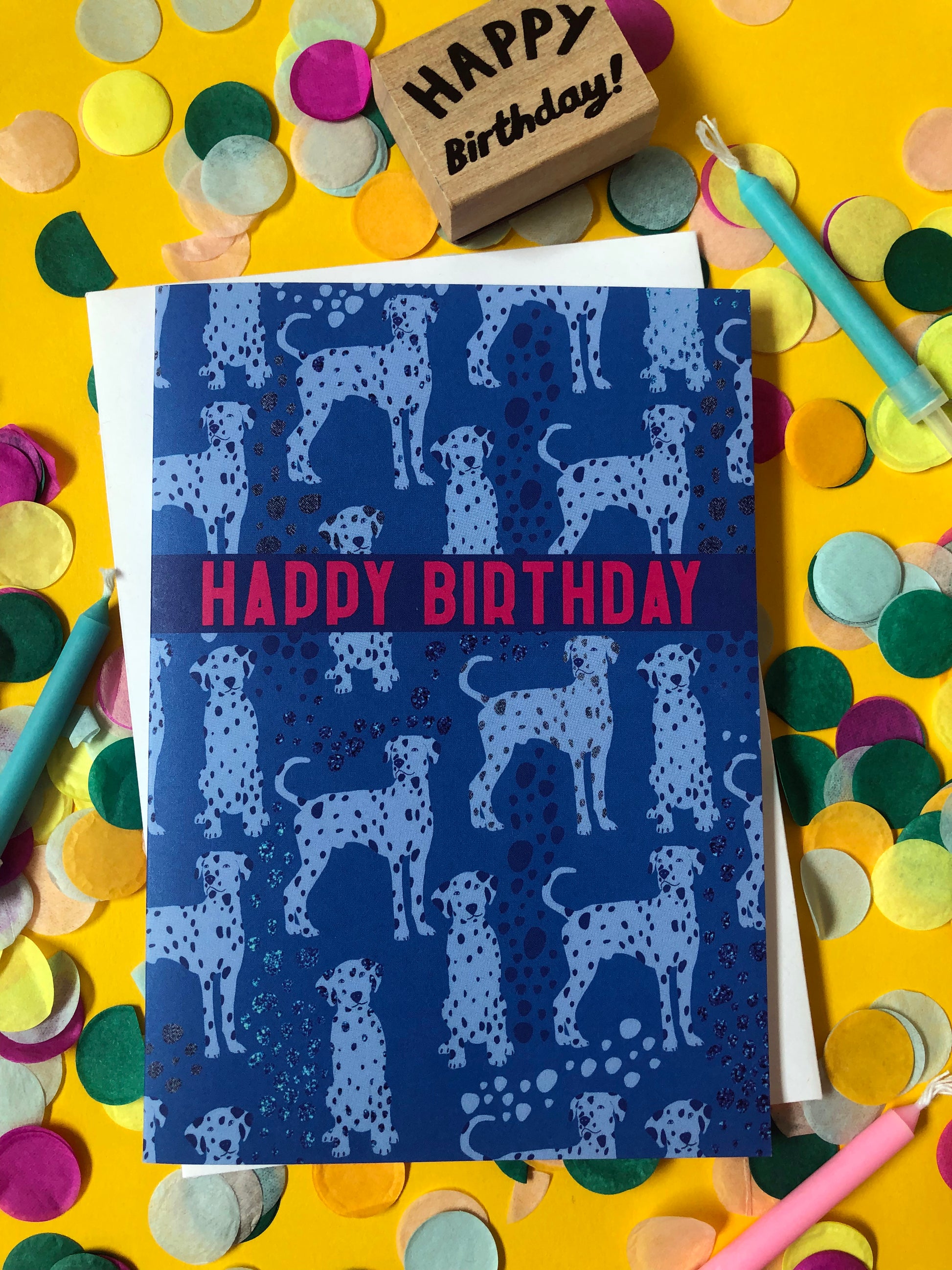 Blue Dalmatian print birthday card featuring a cute dog design on a confetti background.