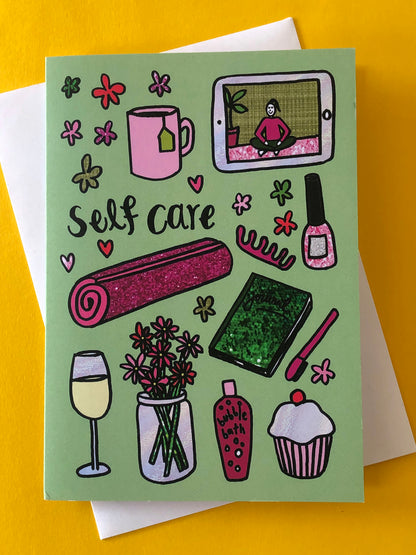 Everyday greetings card that says 'self care' and features a fun pattern of self care items 
