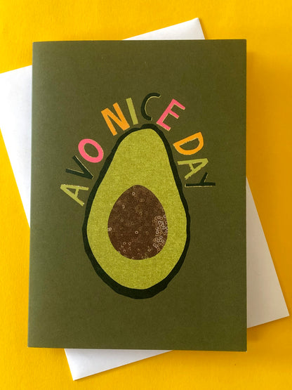 Green "everyday" greetings card that says 'avo nice day' and features an illustration of an avocado