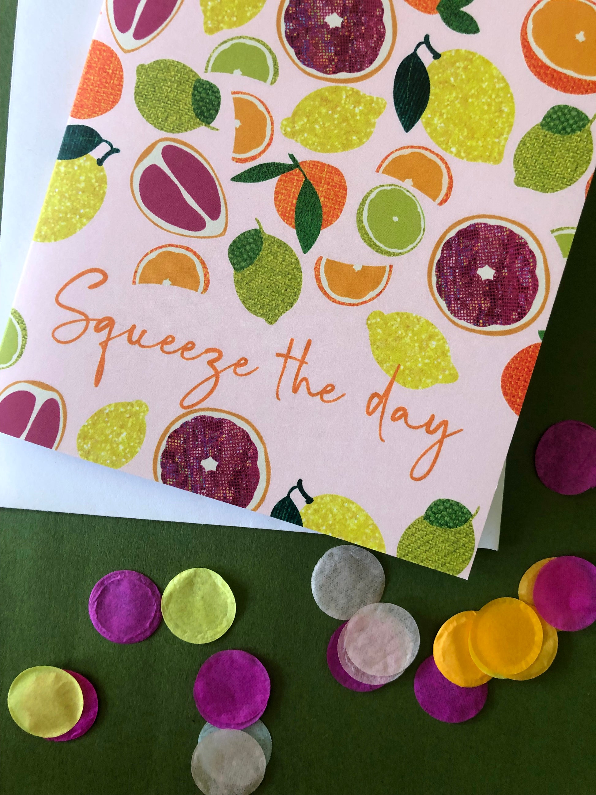 Everyday greetings card that says 'squeeze the day' and features a fun pattern of lemons, oranges, tangerines and grapefruit
