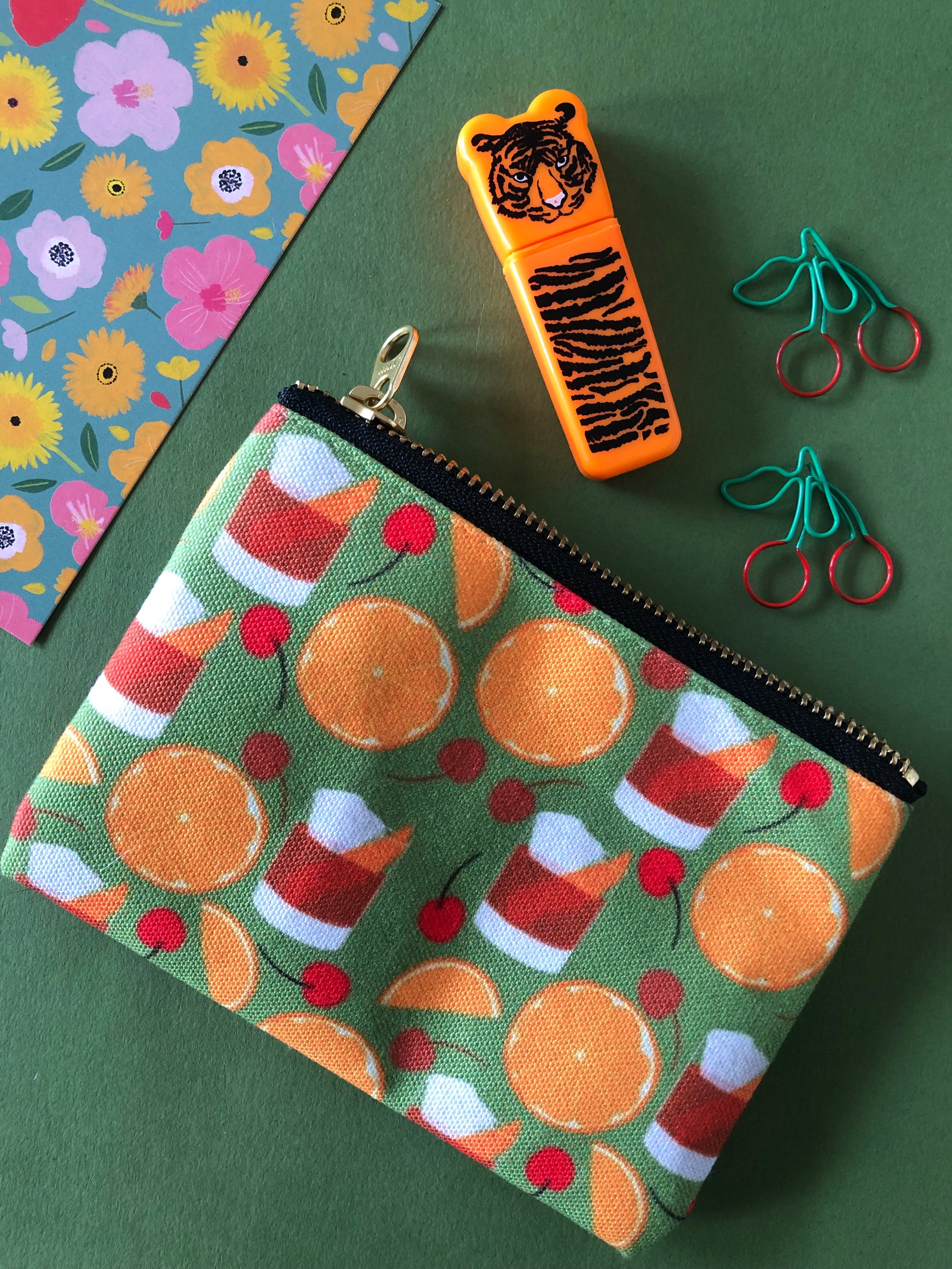 Handy zip pouch featuring a fun retro cocktail inspired design