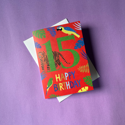 Colourful birthday card with animals and '15 Happy Birthday' text on a purple background