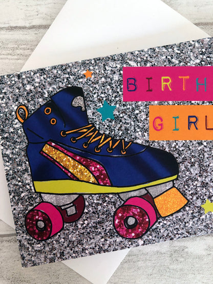Neon and glitter rollerboot birthday girl card on a grey wood background.