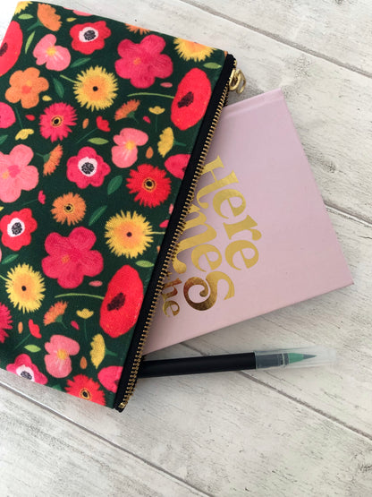 Useful zip pouch in a lush green colour with a pretty pink, yellow and orange floral print