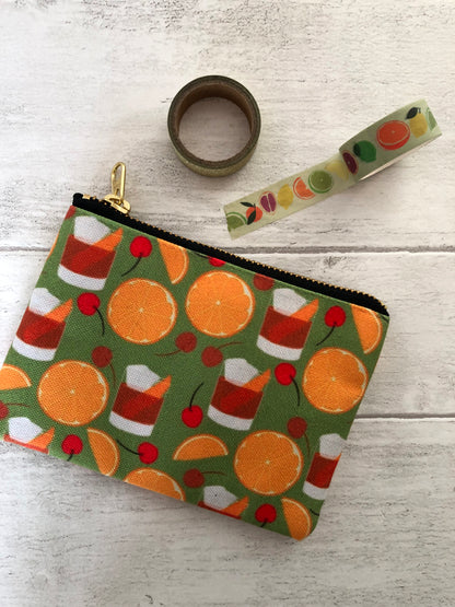 Handy zip pouch featuring a fun retro cocktail inspired design