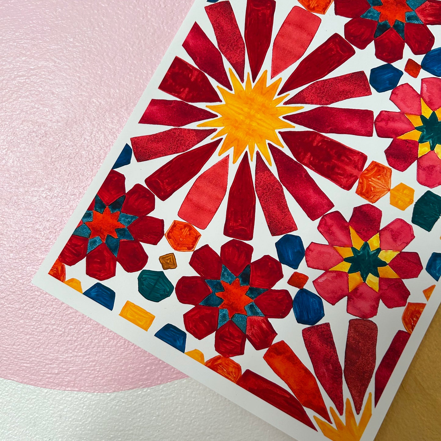 Colourful mosaic design on a pink background