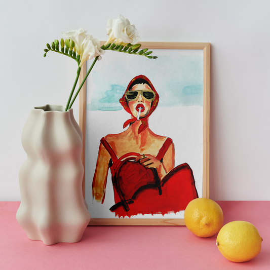 Image shows a framed illustration of a woman in a red dress and headscarf, holding a red bag and smoking with gold sunglasses on