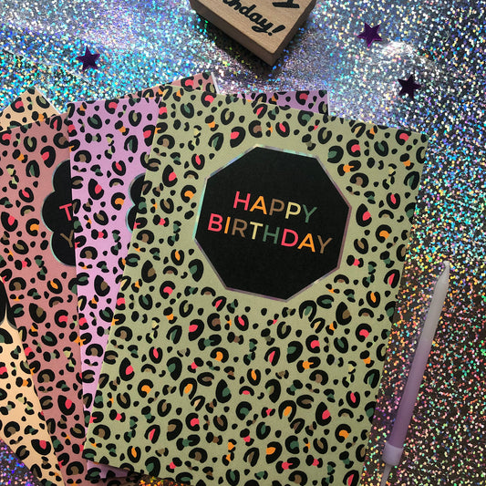 Image shows a fun Happy Birthday card with pale green leopard print and pops of neon.