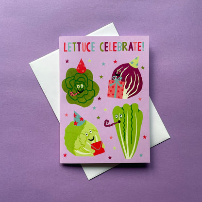 Greeting card with cartoon lettuce characters and 'Lettuce Celebrate!' text on a purple background