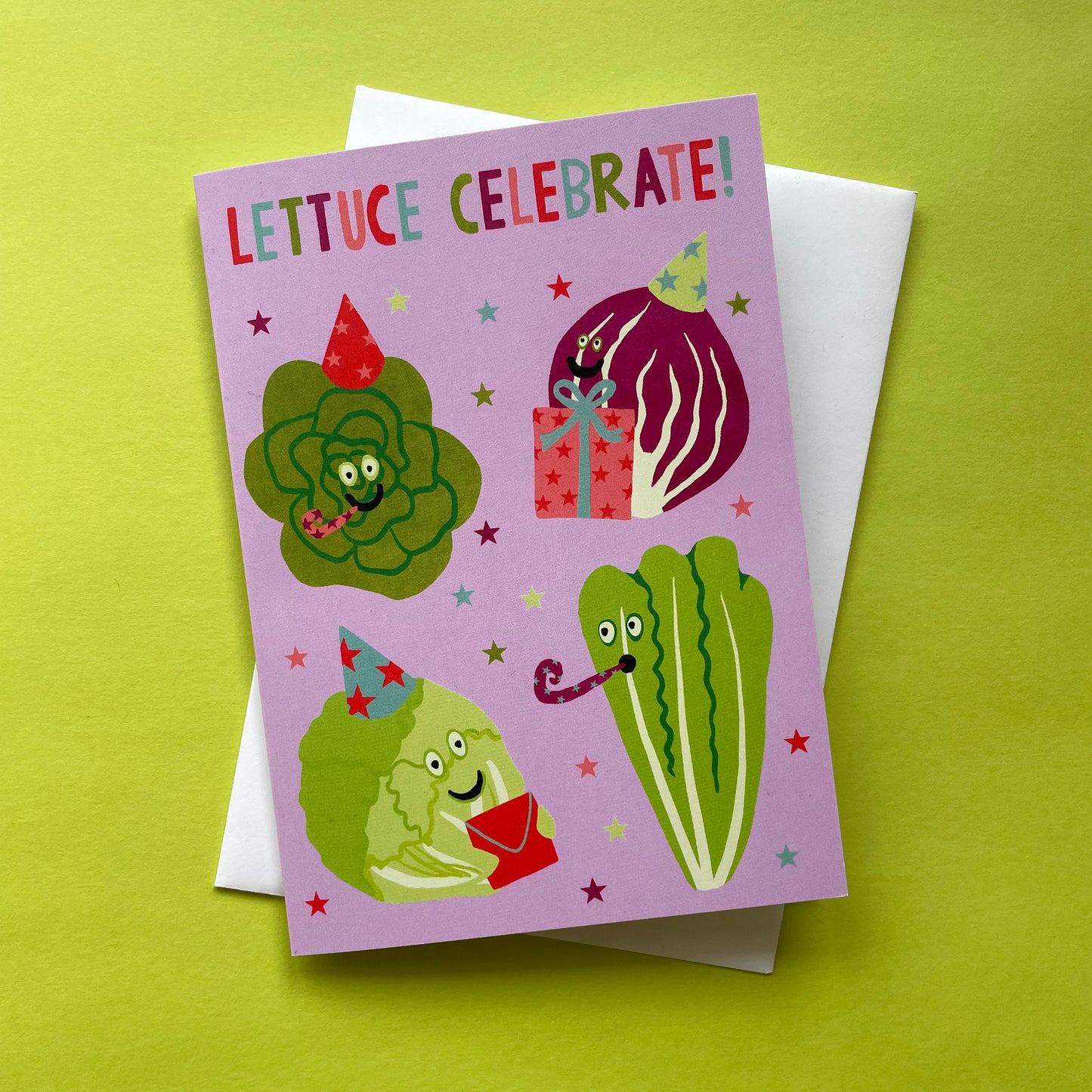 Greeting card with cartoon lettuce characters on a green background
