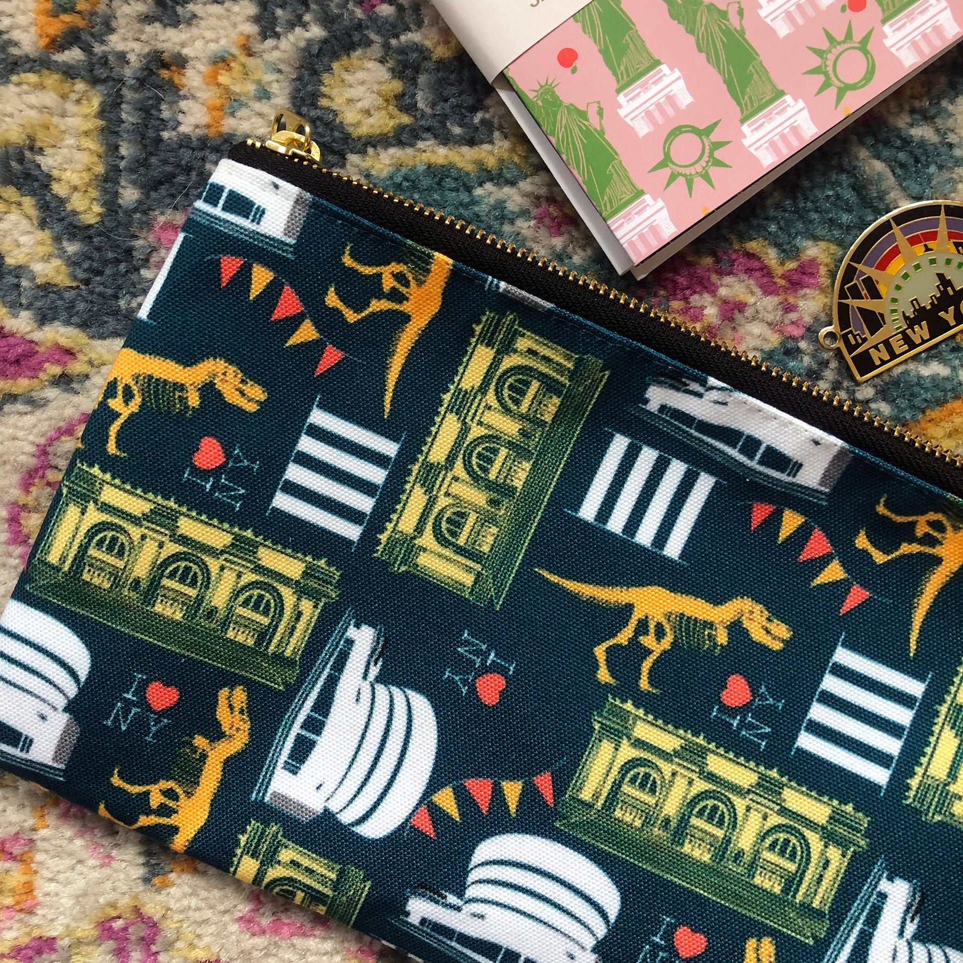 Image of a handy zip pouch in navy blue featuring unique illustrations of New York museums and galleries.