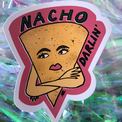 Image shows a vinyl sticker featuring an illustration of a nacho with her arms crossed and he wording 'Nacho Darlin'