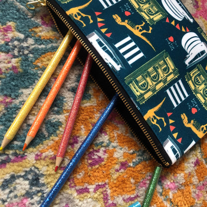Image of a handy zip pouch in navy blue featuring unique illustrations of New York museums and galleries.