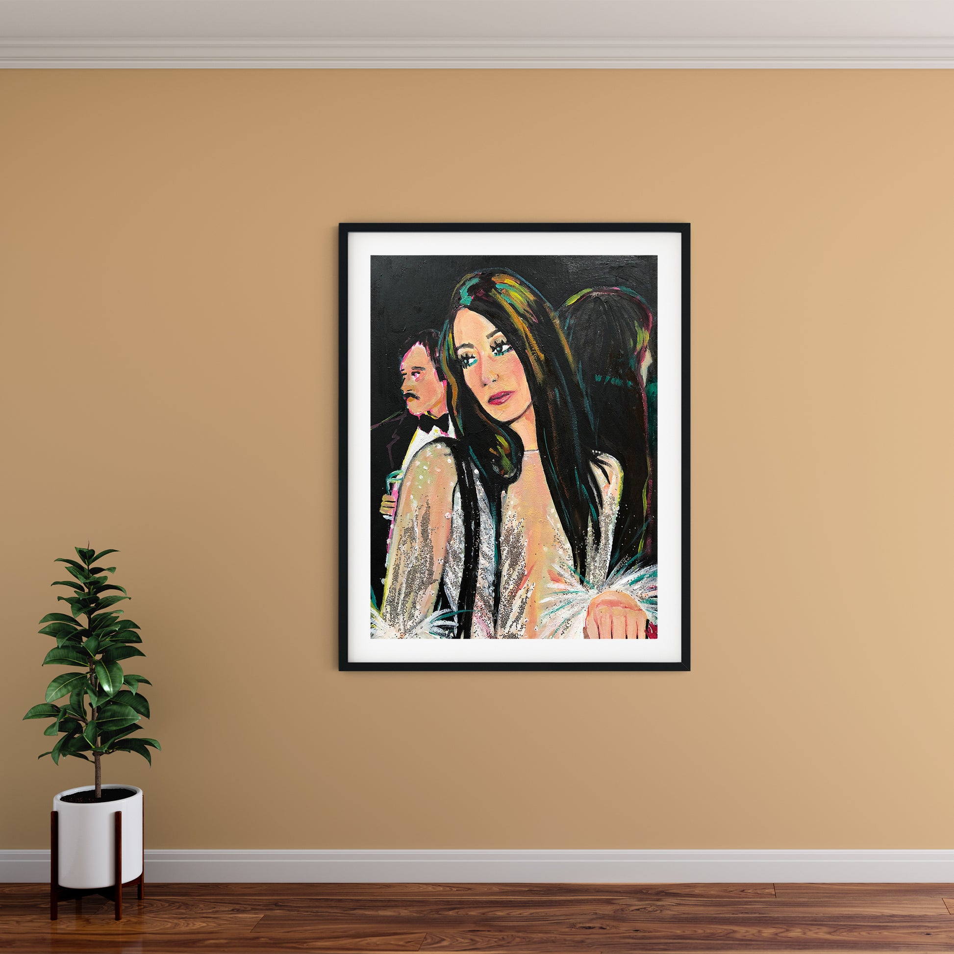 Image shows a framed portrait of Cher at studio 54 wearing a silver sparkly outfit with feathered sleeves. 