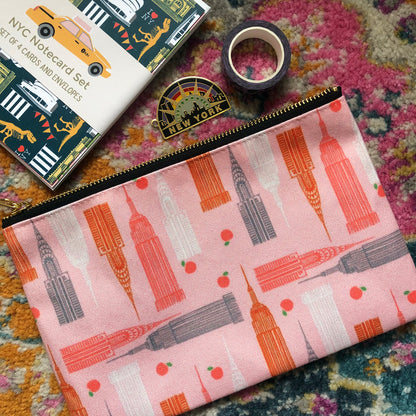 Handy zip pouch in pastel pink featuring a unique design inspired by the skyscrapers of NYC 