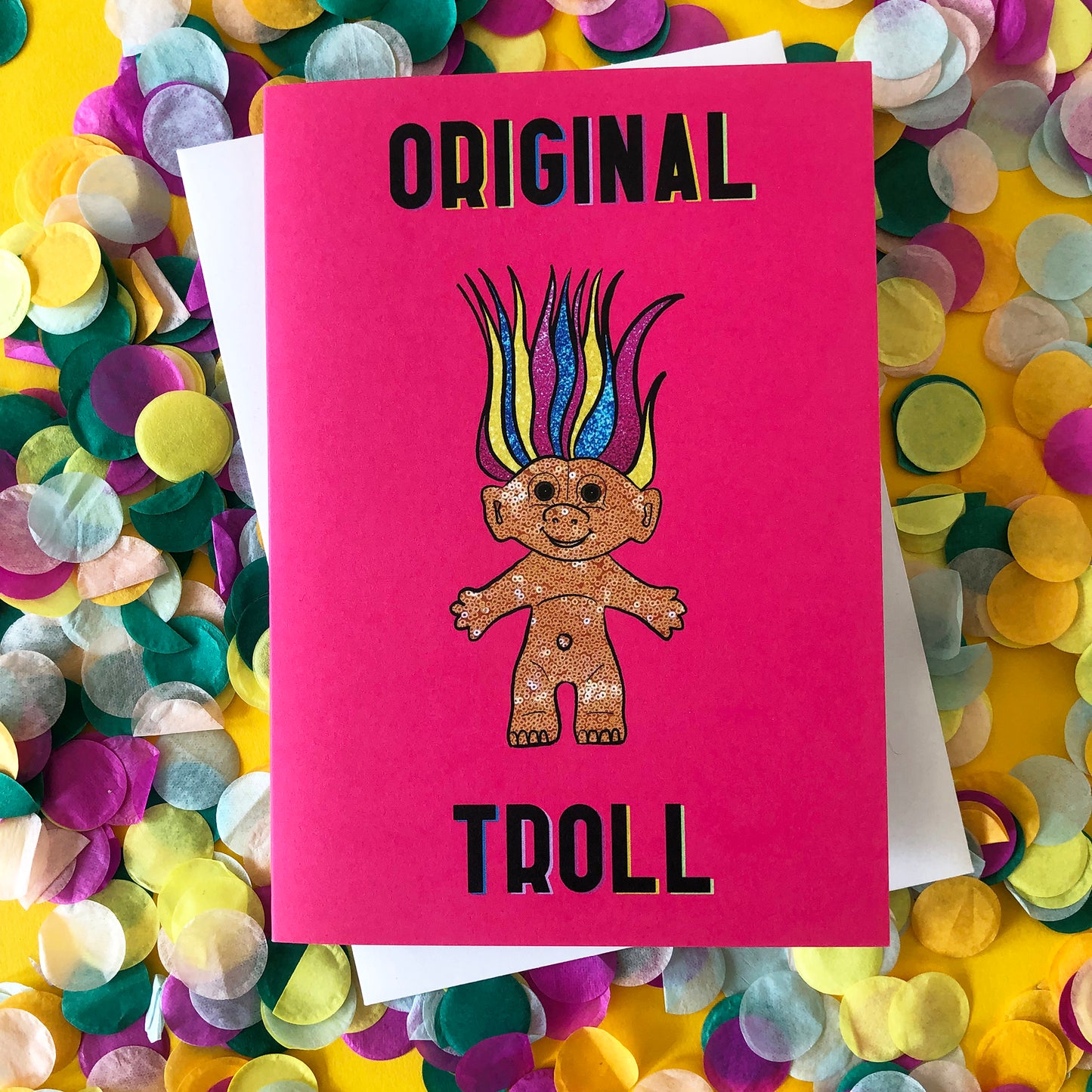 Image shows a bright Pink Greetings Card featuring an illustration of a nineties troll doll