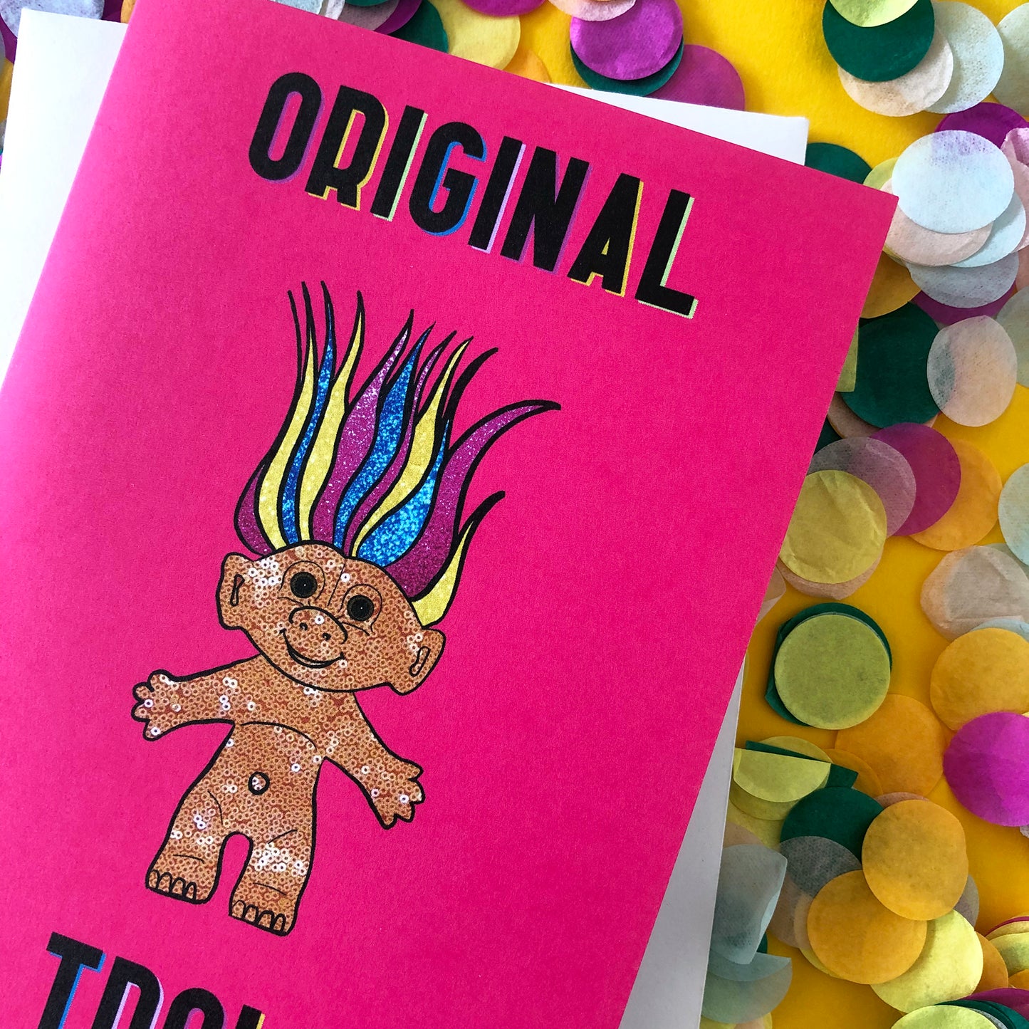 Image shows a bright Pink Greetings Card featuring an illustration of a nineties troll doll