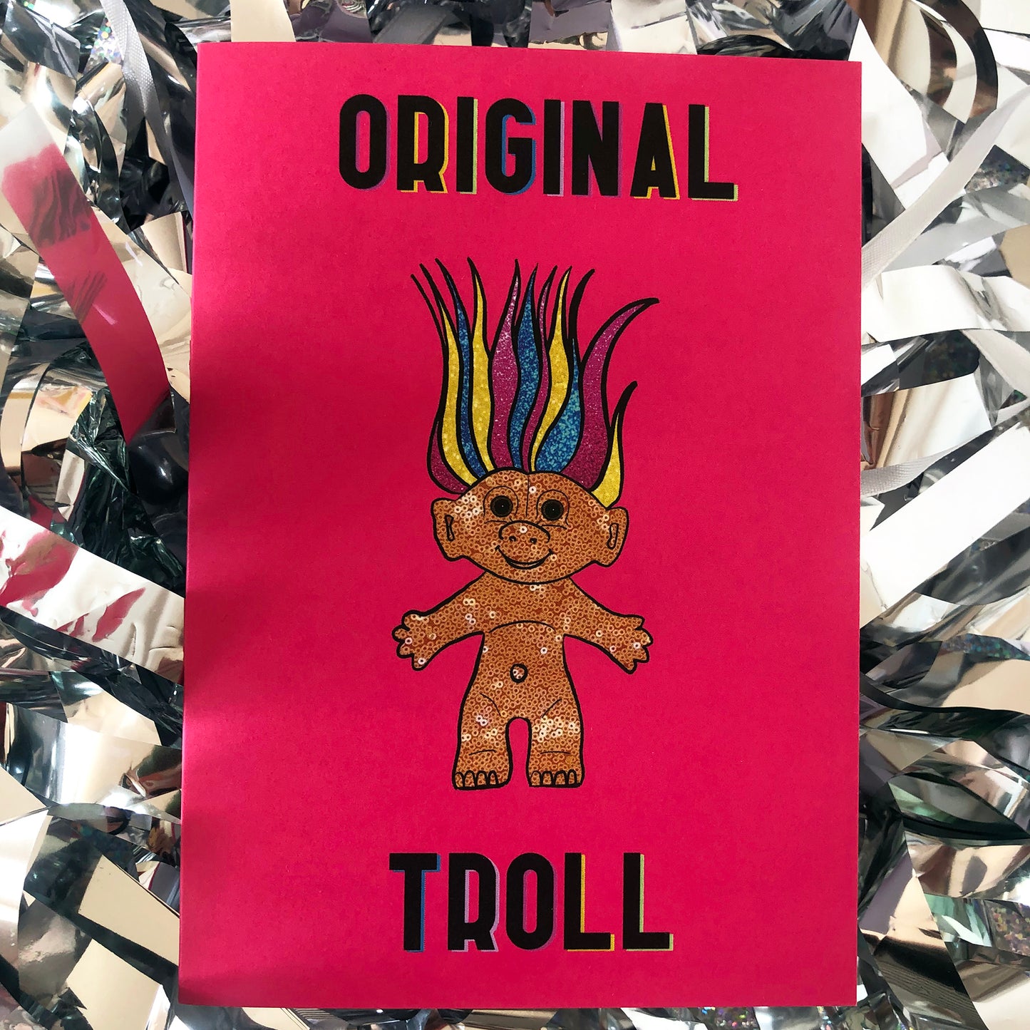 Image shows a bright Pink Greetings Card featuring an illustration of a nineties troll doll