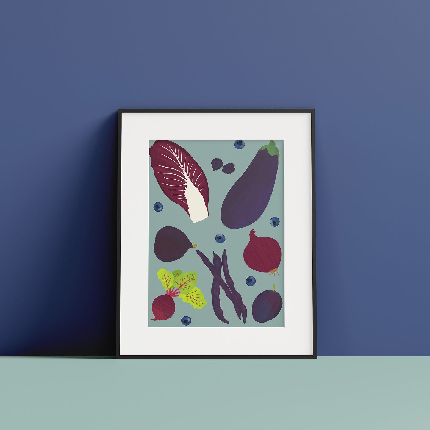 Image of a framed art print of purple fruit and vegetables on a pale indigo background.