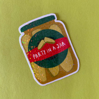 Sticker of a jar with a red label saying 'Party in a Jar' on a green background