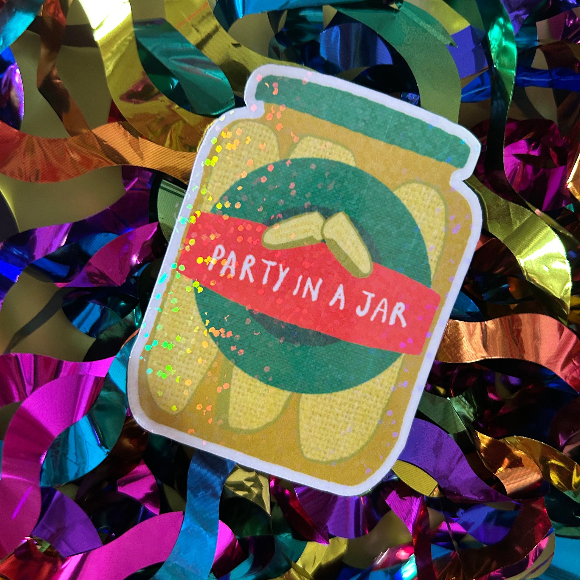 Decorative sticker with 'Party in a Jar' text on a colorful confetti background