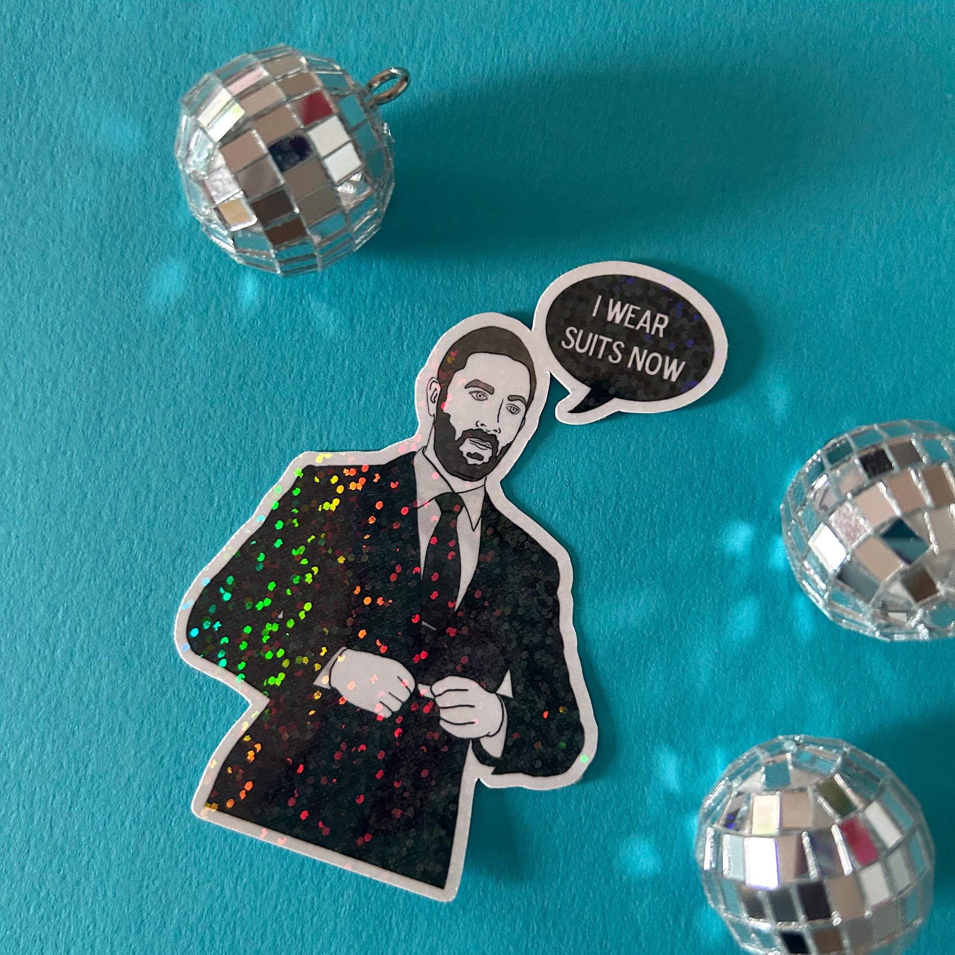 Sticker of Richie from the Bear in a suit with a speech bubble and disco balls on a blue background