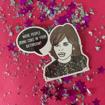 Sticker of Lisa Rinna asking 'Were people doing coke in your bathroom?'  and confetti on a red background
