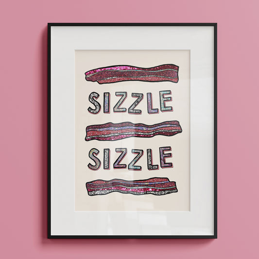 Image of a framed art print of a modern illustration glittery bacon and the words Sizzle Sizzle.