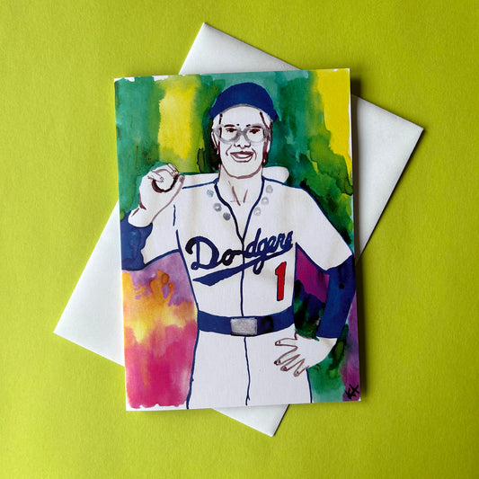 Card with a colorful illustration of a baseball player in a Dodgers uniform on a green background