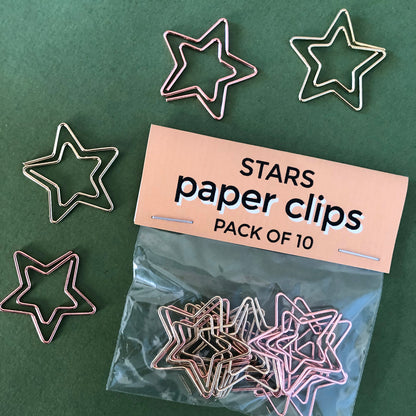 Image shows a set of gold and rose gold, starshaped paperclips.