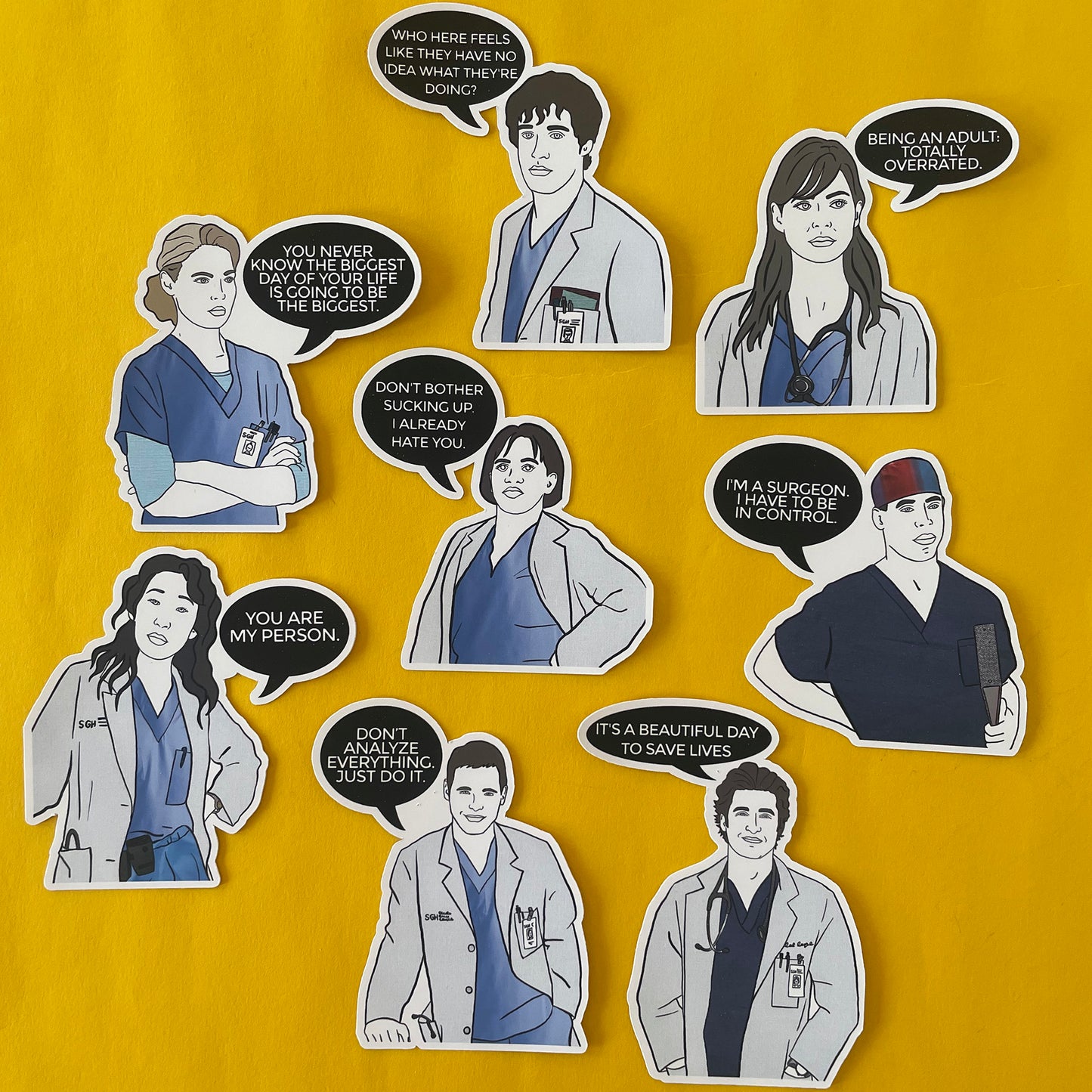 Image shows a set of hand drawn stickers inspired by the cast of Grey's Anatomy.