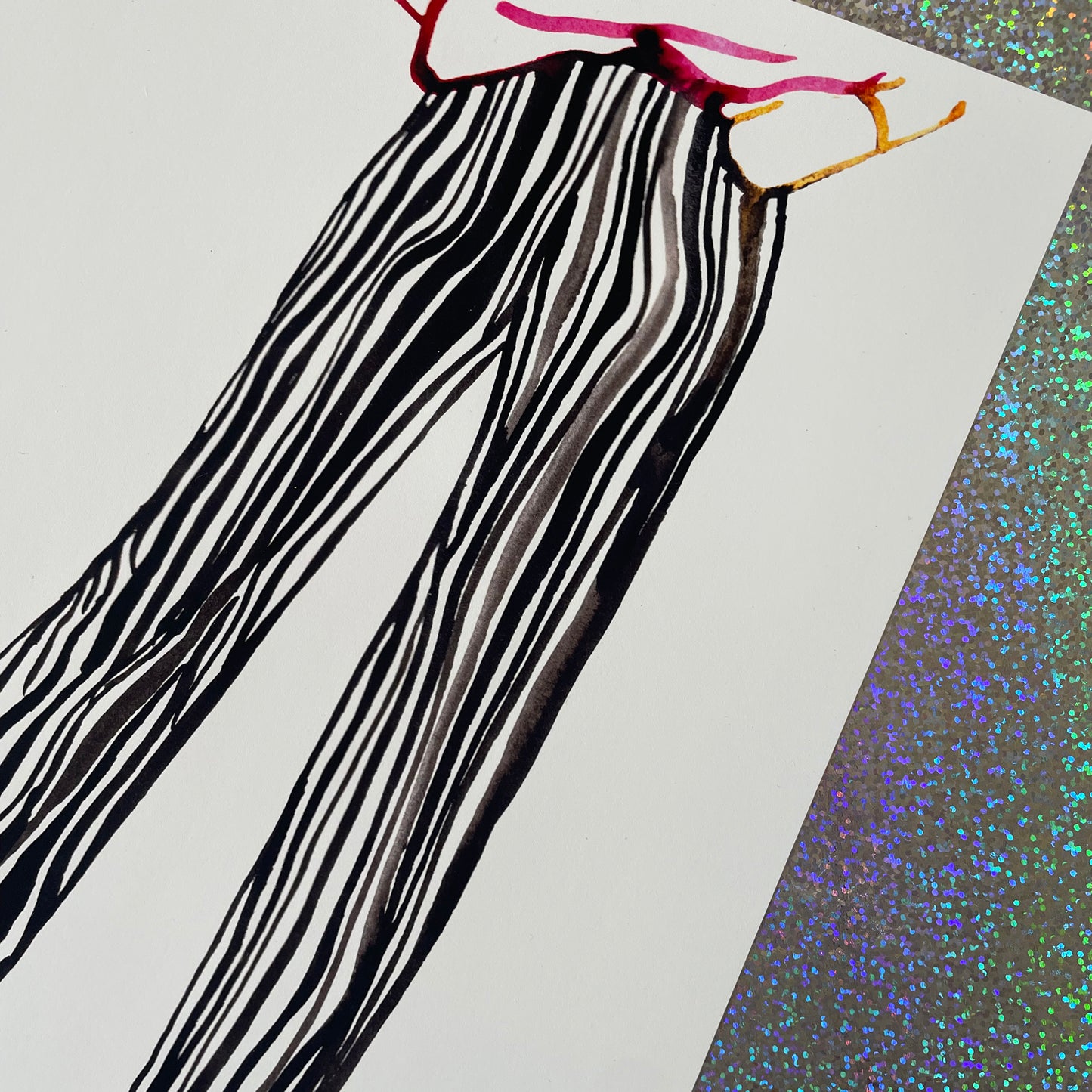 Image shows a framed fashion illustration of striped trousers featuring bold ink lines