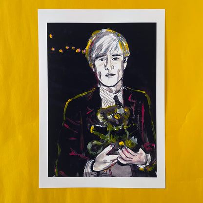 Image shows a framed portrait of artist Andy Warhol holding a teddy bear. The artwork is painted in black and white with  neon pink and yellow highlights.