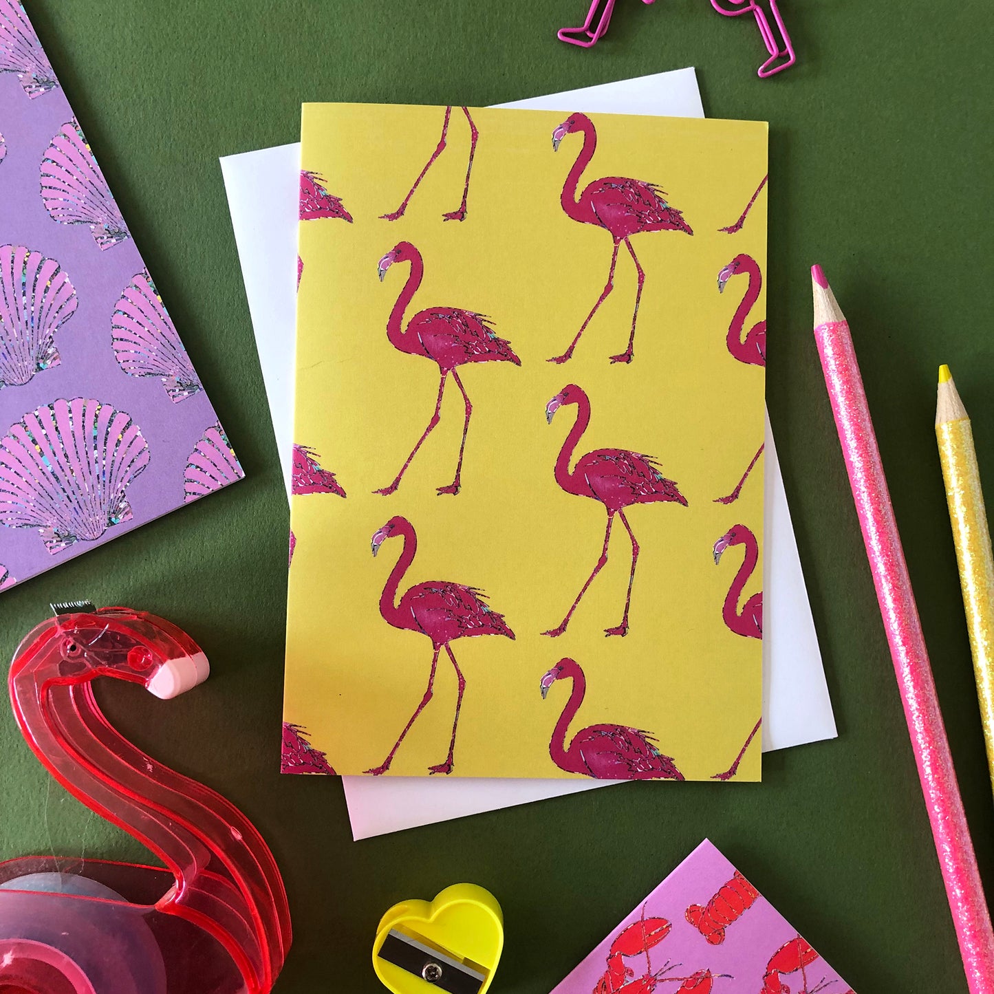 Image shows an illustrated notecard featuring vibrant summer flamingo pattern