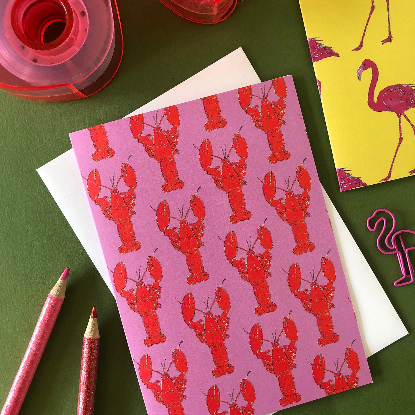 Image shows an illustrated notecard featuring vibrant summer lobster pattern