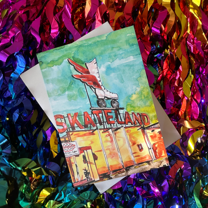 Card with roller skates and 'Skate Land' text on a colourful tinsel background