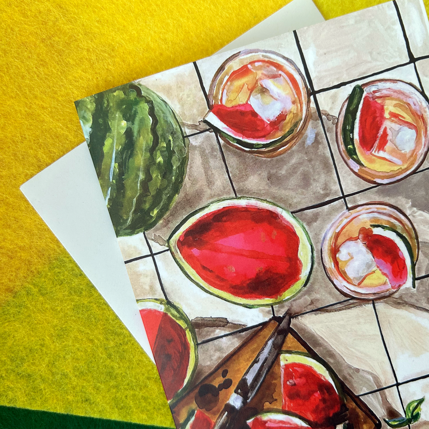 Illustration of watermelon slices and a glass of juice on a tiled surface.