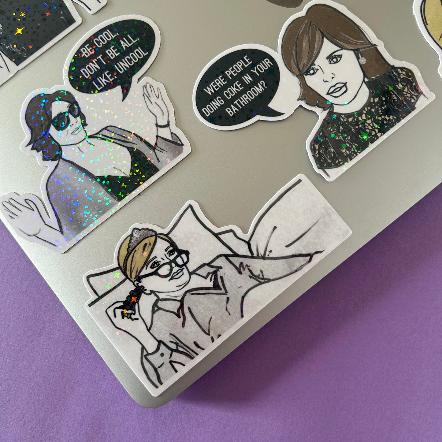 Set of stickers with illustrated characters from RHONY on a laptop and a purple background