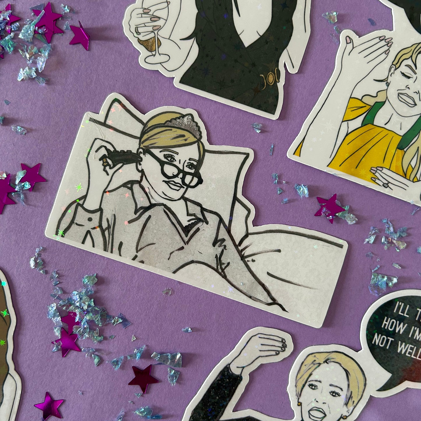 Sticker of Sonja from RHONY watching TV in bed wearing a tiaraon a purple background with star-shaped confetti