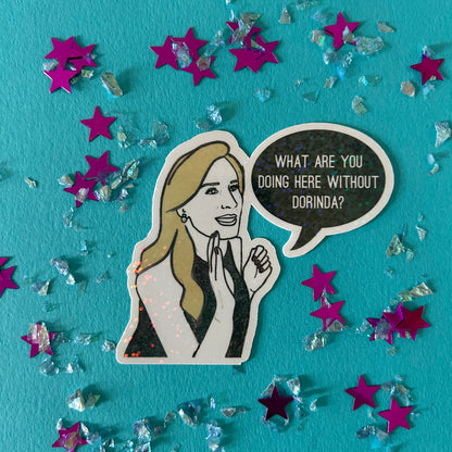 Sticker of a woman with a speech bubble asking 'What are you doing here without Dorinda?' on a blue background with stars and confetti.