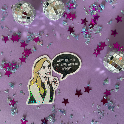 Sticker of a woman with a speech bubble on a purple background with stars and disco balls.