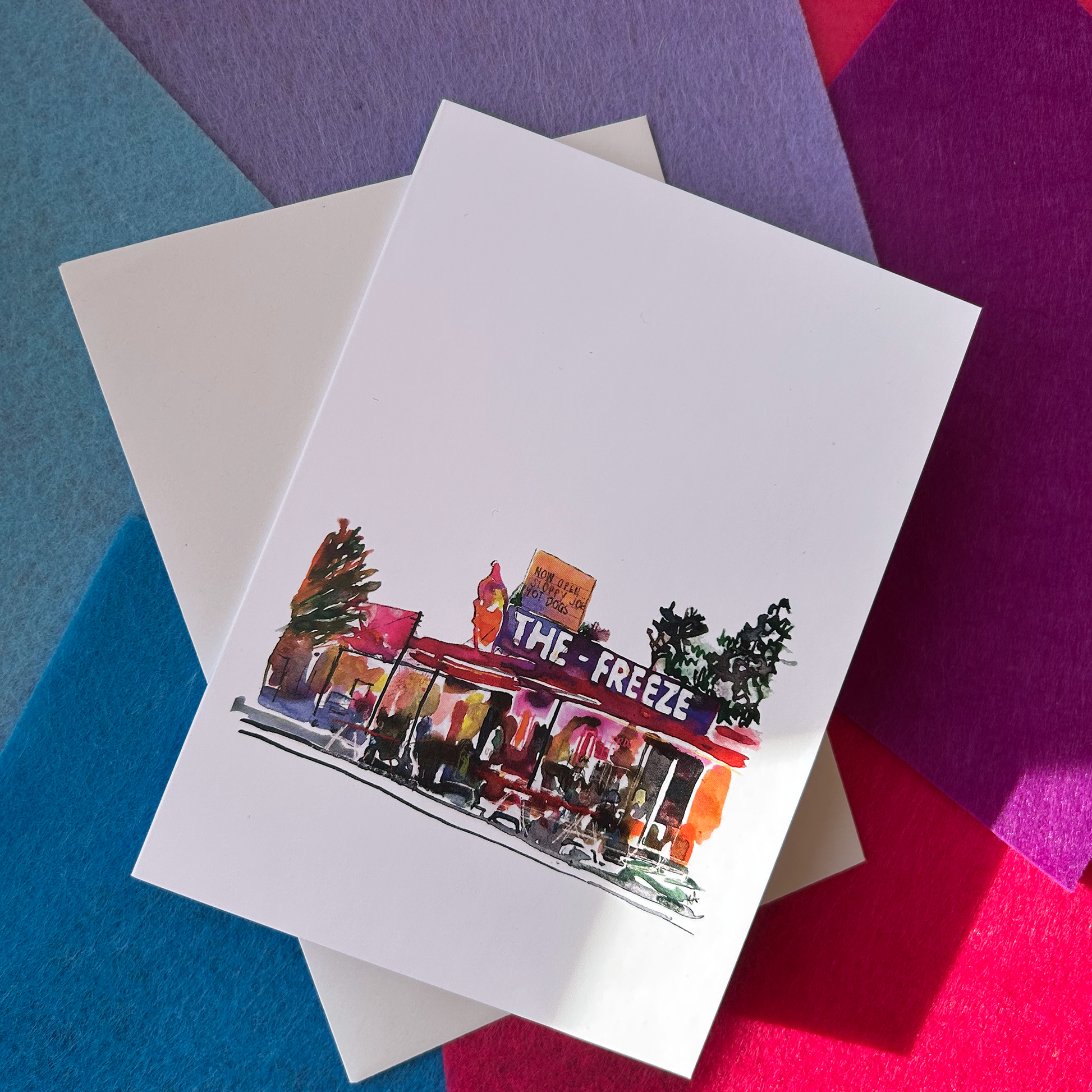 Greeting card with 'The Freeze' illustration on a colourful background