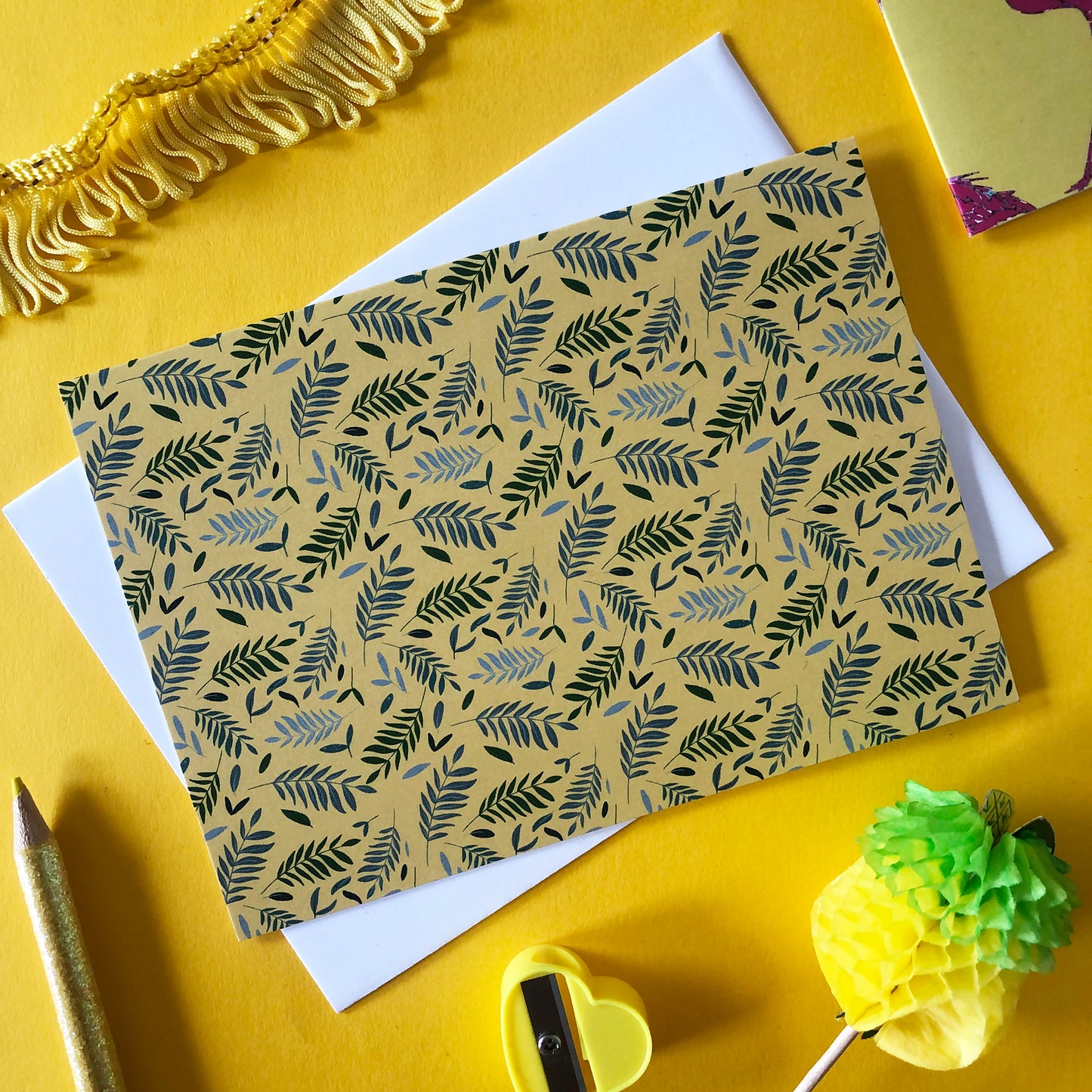 Image shows a yellow notecard from a set of 4 illustrated notecards, each in a different colour and featuring a beautiful tropical leaves pattern.