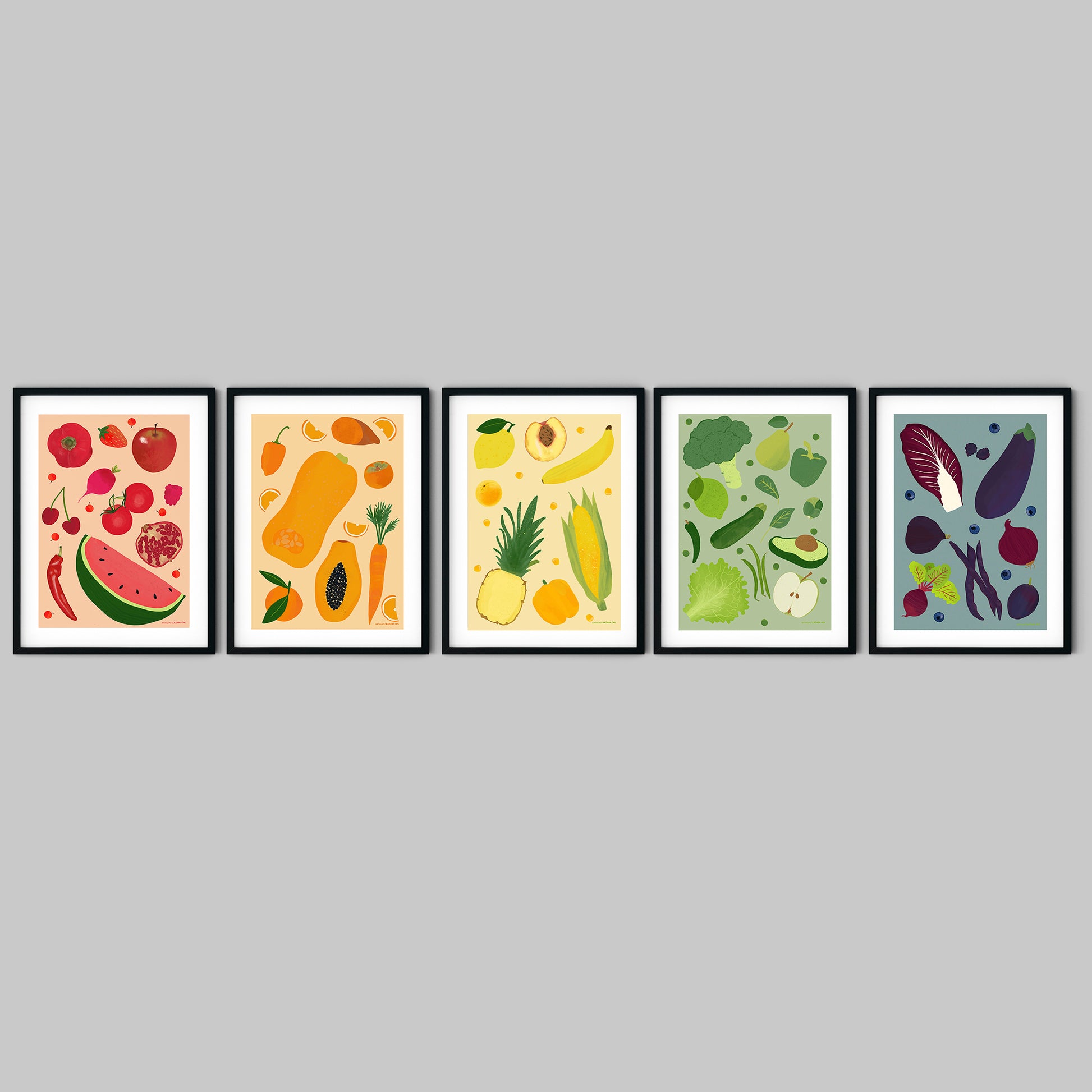 Image of a set of 5 framed art prints of fruit and vegetables. Each print is a different colour theme, red, orange, yellow, green and purple.