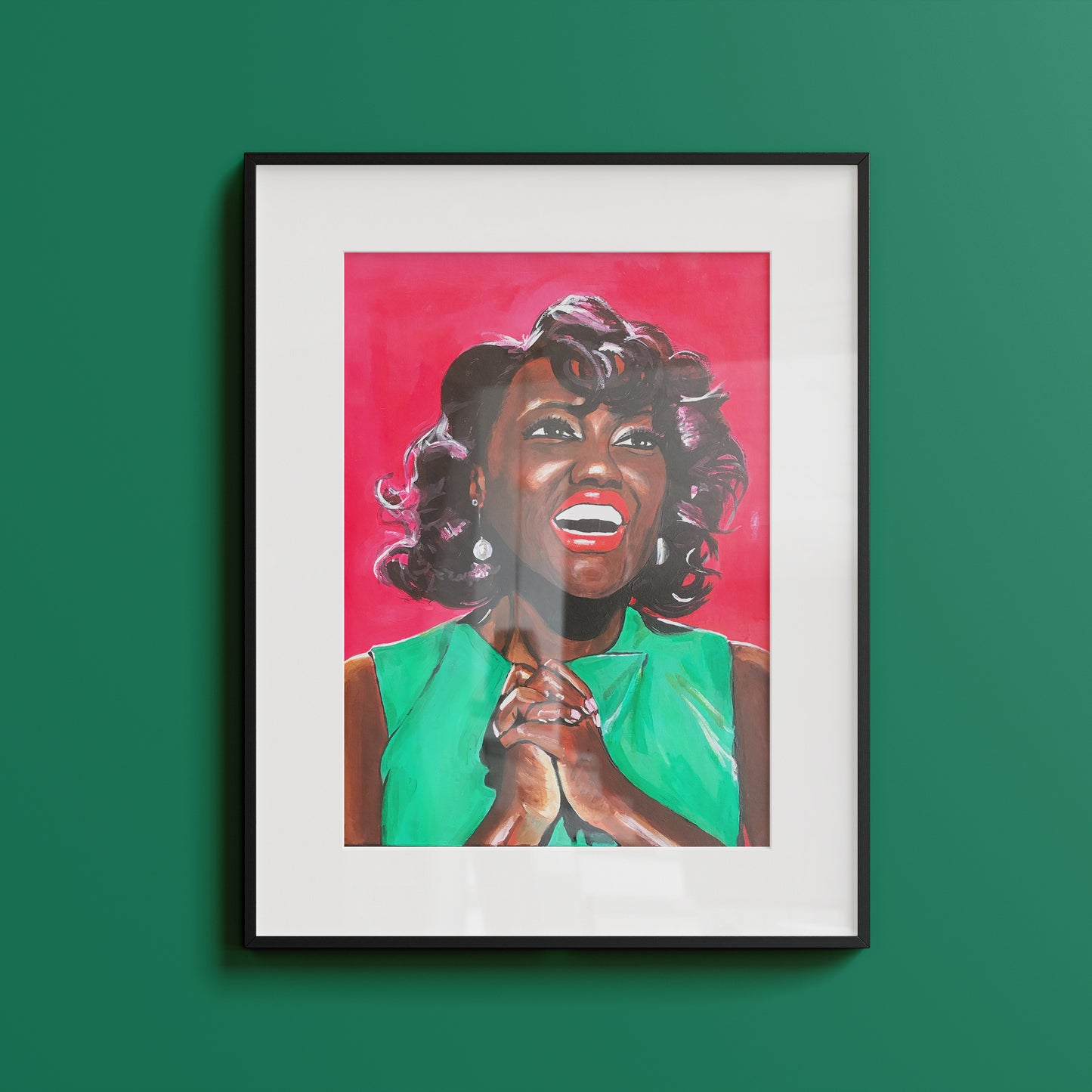 Image shows a joyful portrait of Viola Davis wearing a bright green dress, clasping her hands together and smiling on a bright pink background