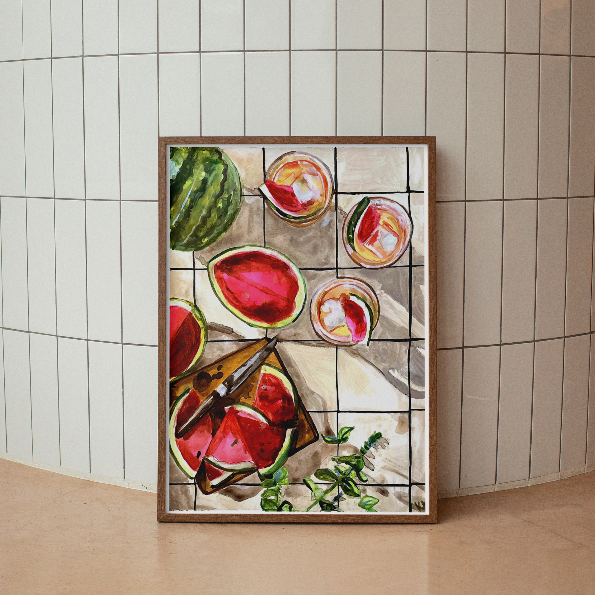 Framed artwork of watermelons on a tiled wall