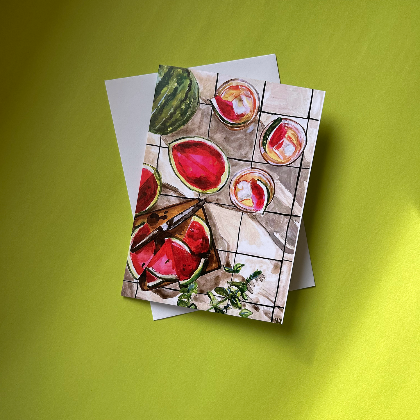 Greeting card with watermelon design on a green background
