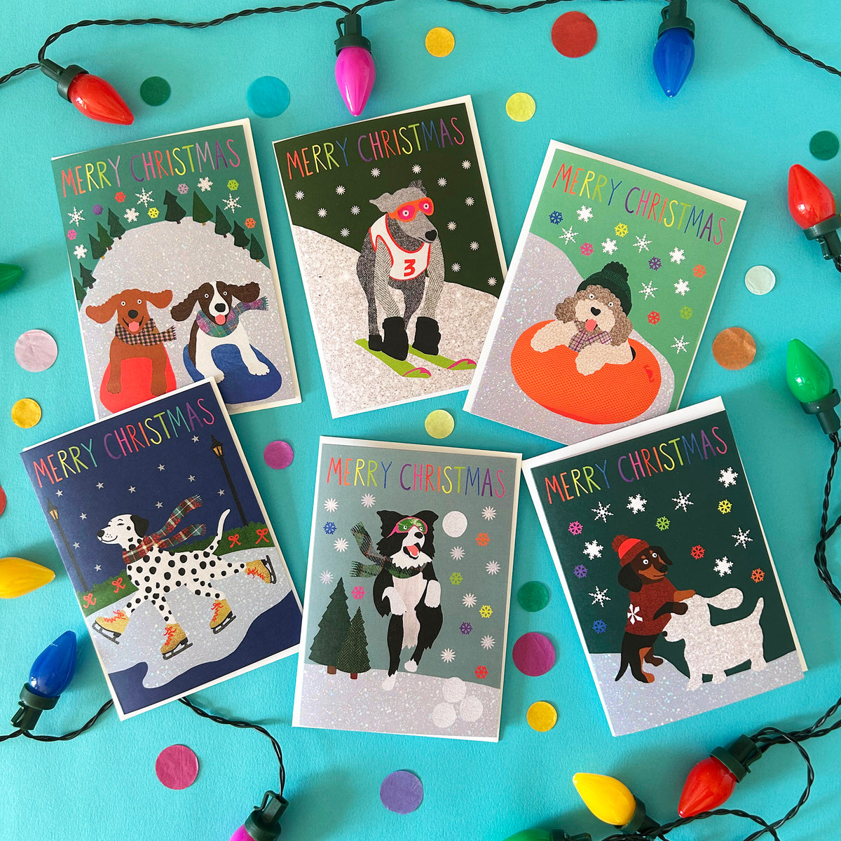 Set of Christmas cards with dog illustrations on a blue background with Christmas lights.